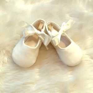 White ribboned booties